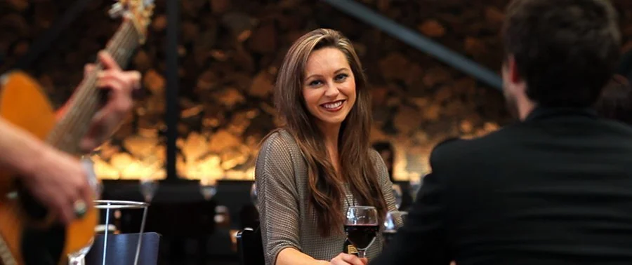 Female Customer smiling while having dinner in Maranellos Restaurant Maroubra
